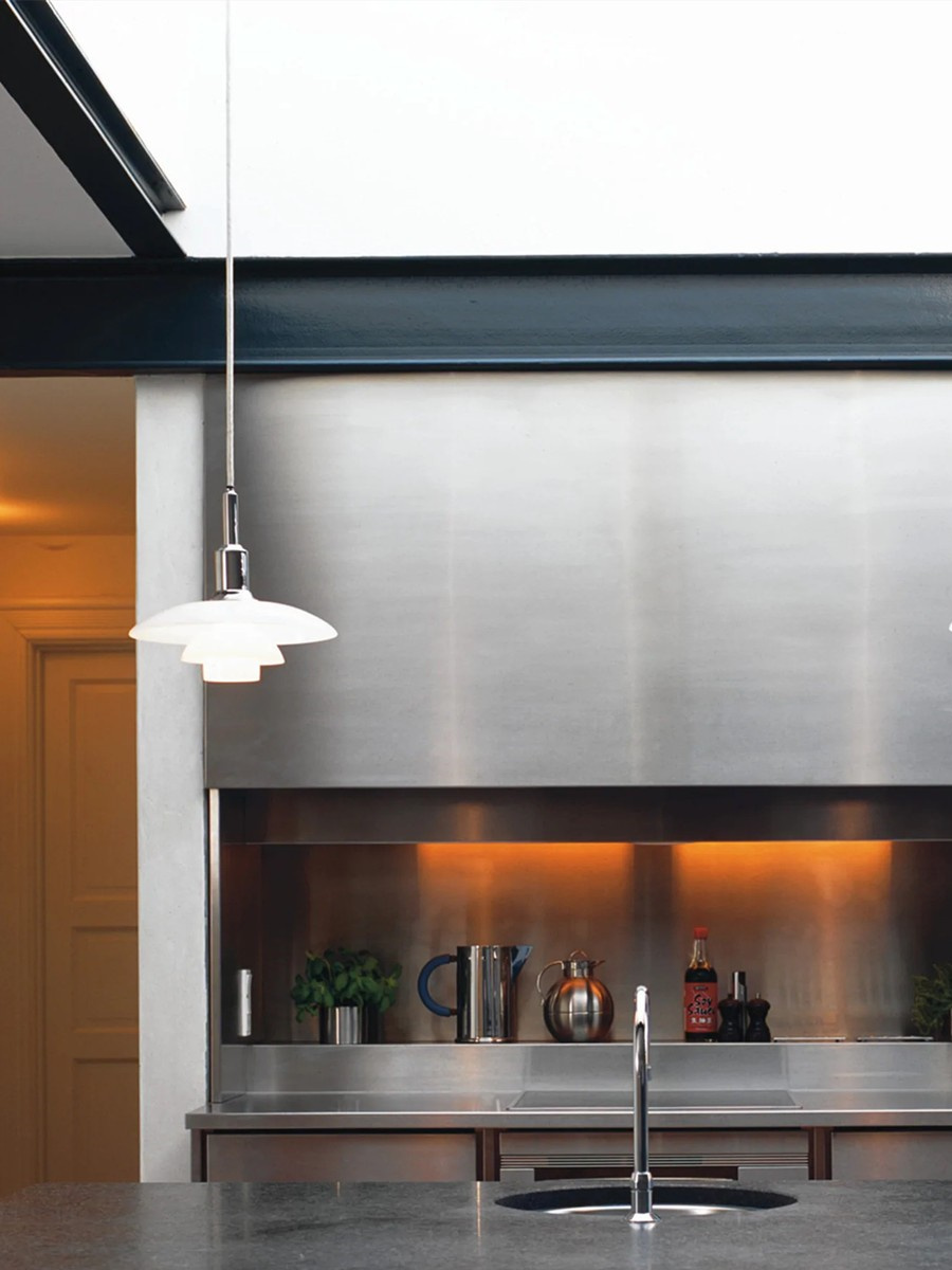 Opal glass disc pendant suspended above a kitchen island