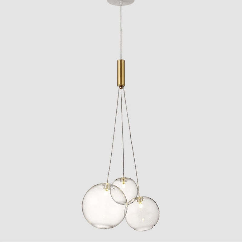 Isolated Valentina Transparent 3-bubble cluster on pale gray, with small central lights and a gold-tone fitting