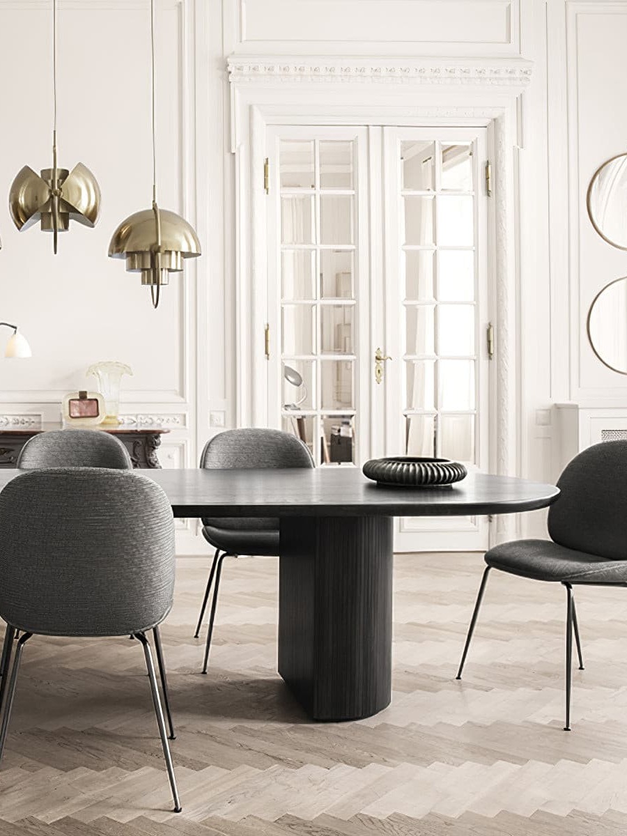 Copper-finish pendants in a light dining room