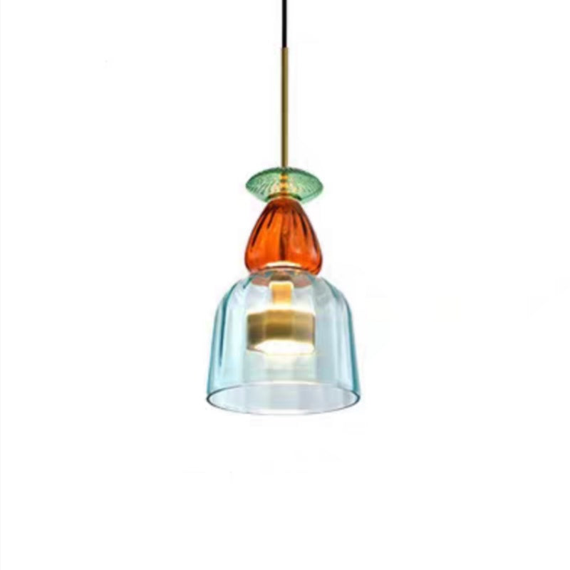 Aqua glass bell pendant below amber top and green disk