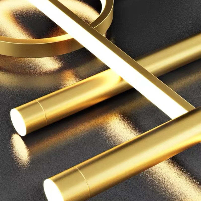 Close view of Madina gold cylinders, illuminated bar and intersecting rings