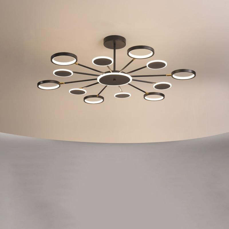 Twelve-arm radial ring and disc fixture with flat glowing heads beneath a round ceiling canopy