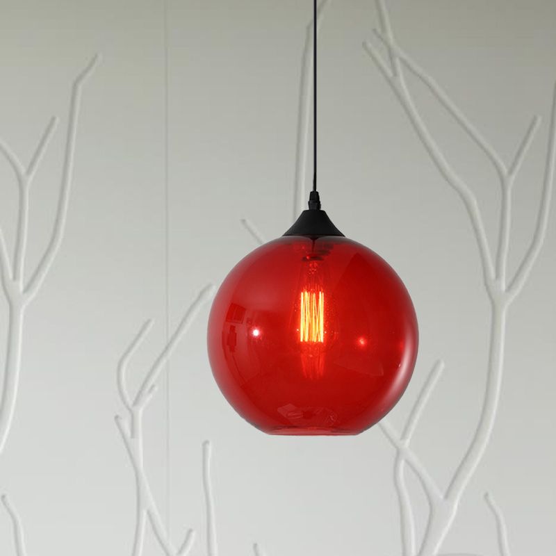 Red glass globe pendant in a pale room