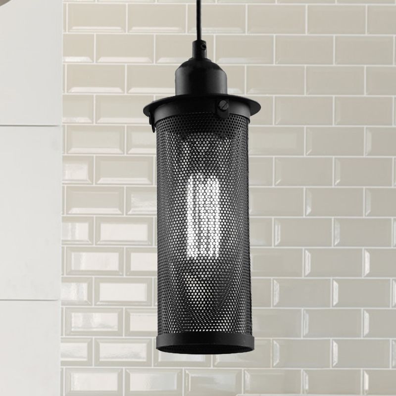 Black Sanna pendant against a white tiled wall