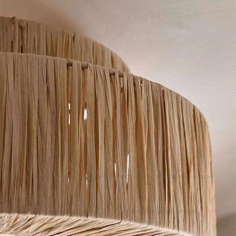 Tan strands wrapped vertically around the curved shade rim, showing small gaps and the upper cylindrical layer