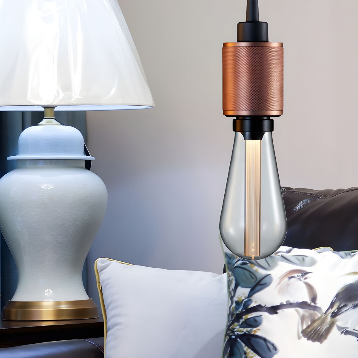 Cooley Copper pendant holder pictured beside a sofa