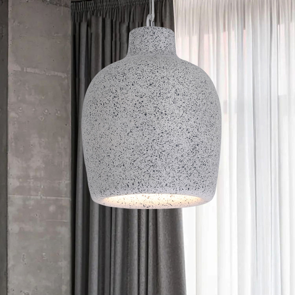 Speckled Gray Byers jar-shaped shade suspended beside dark and sheer curtains, with its open underside illuminated.