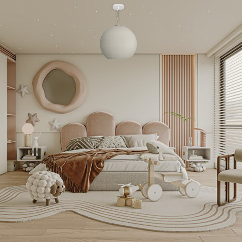 White Byers ball-shaped pendant above a softly coloured bedroom.