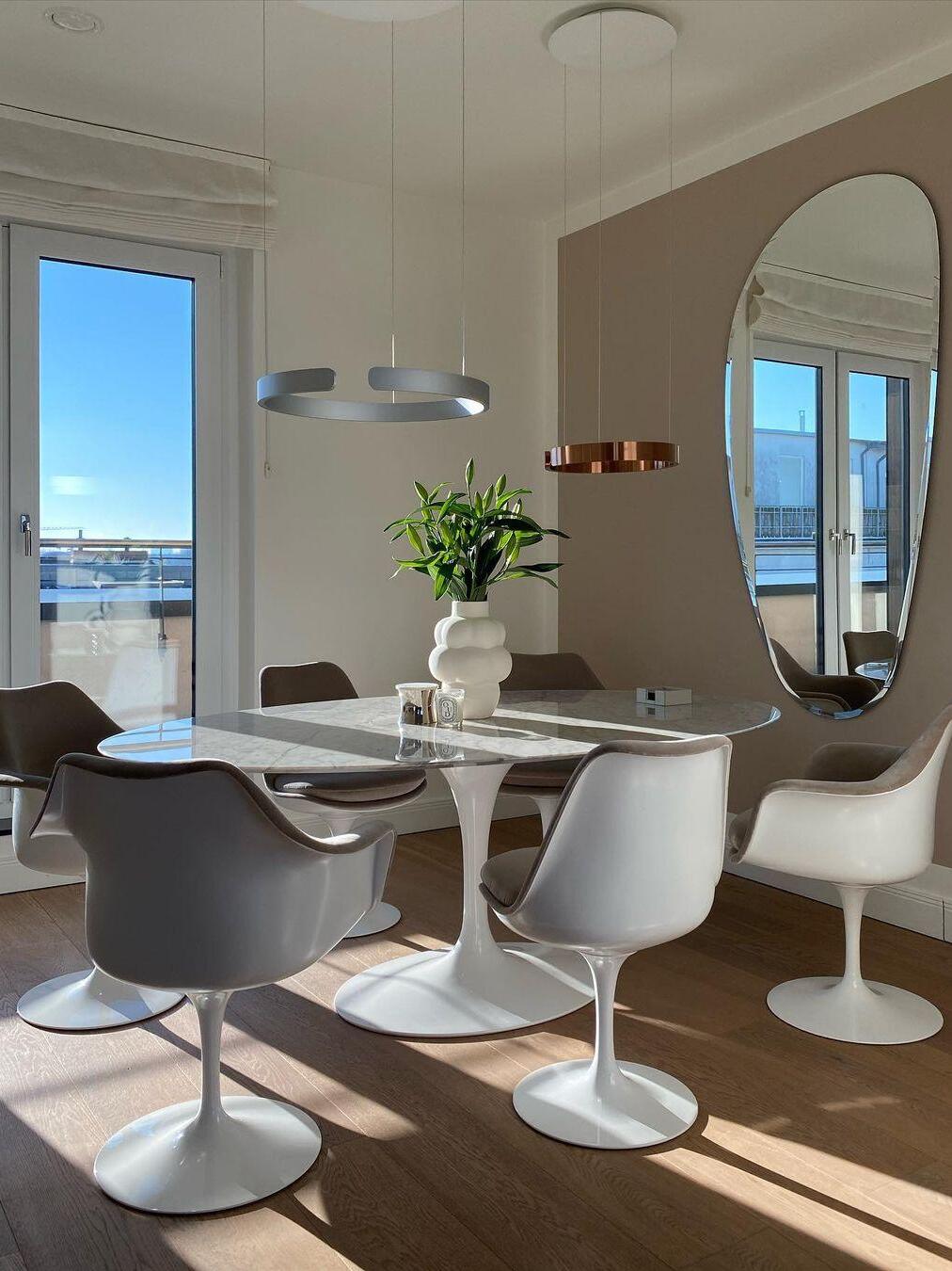 Metallic ring lighting above a bright dining area
