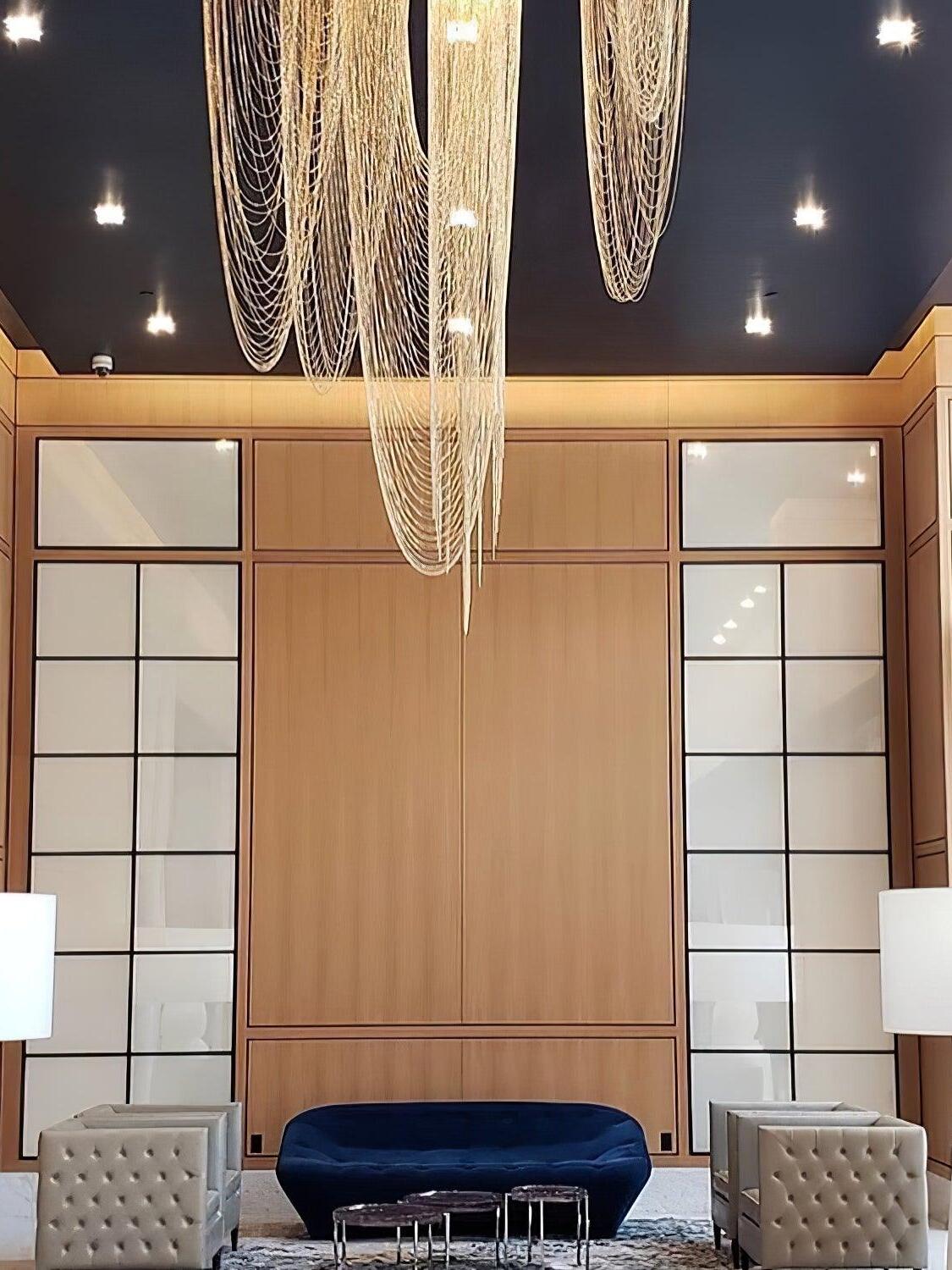 Long hanging chain loops above a seating area