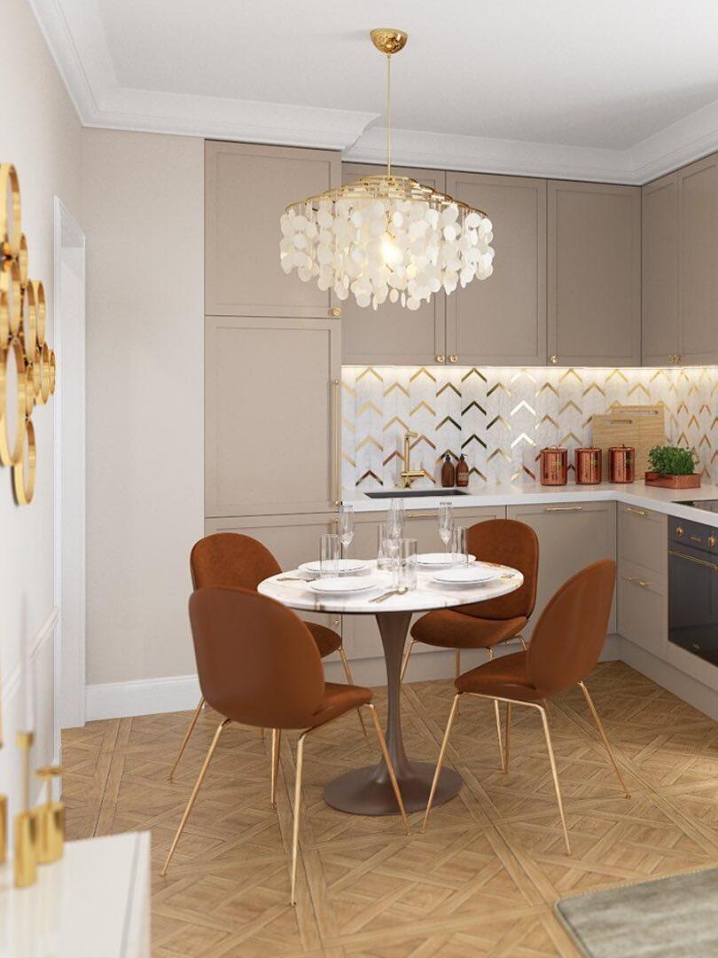 White shell chandelier above a round dining table