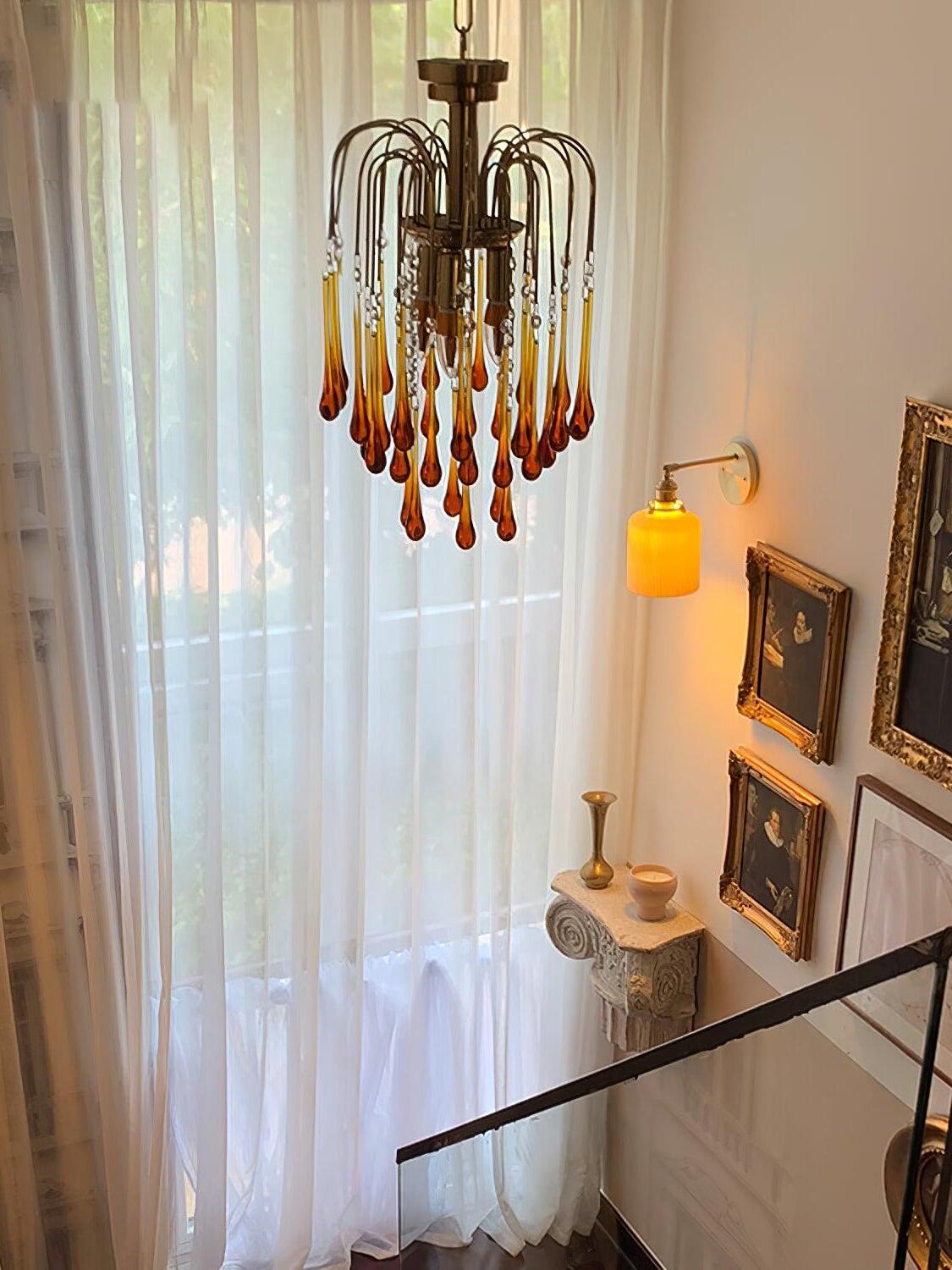 Compact Caramel chandelier beside curtains
