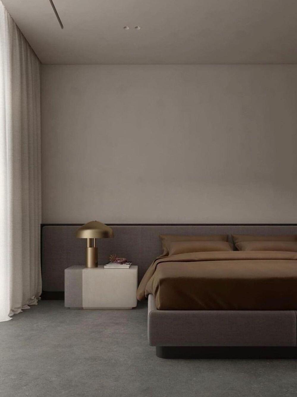 Gold dome table lamp beside bed