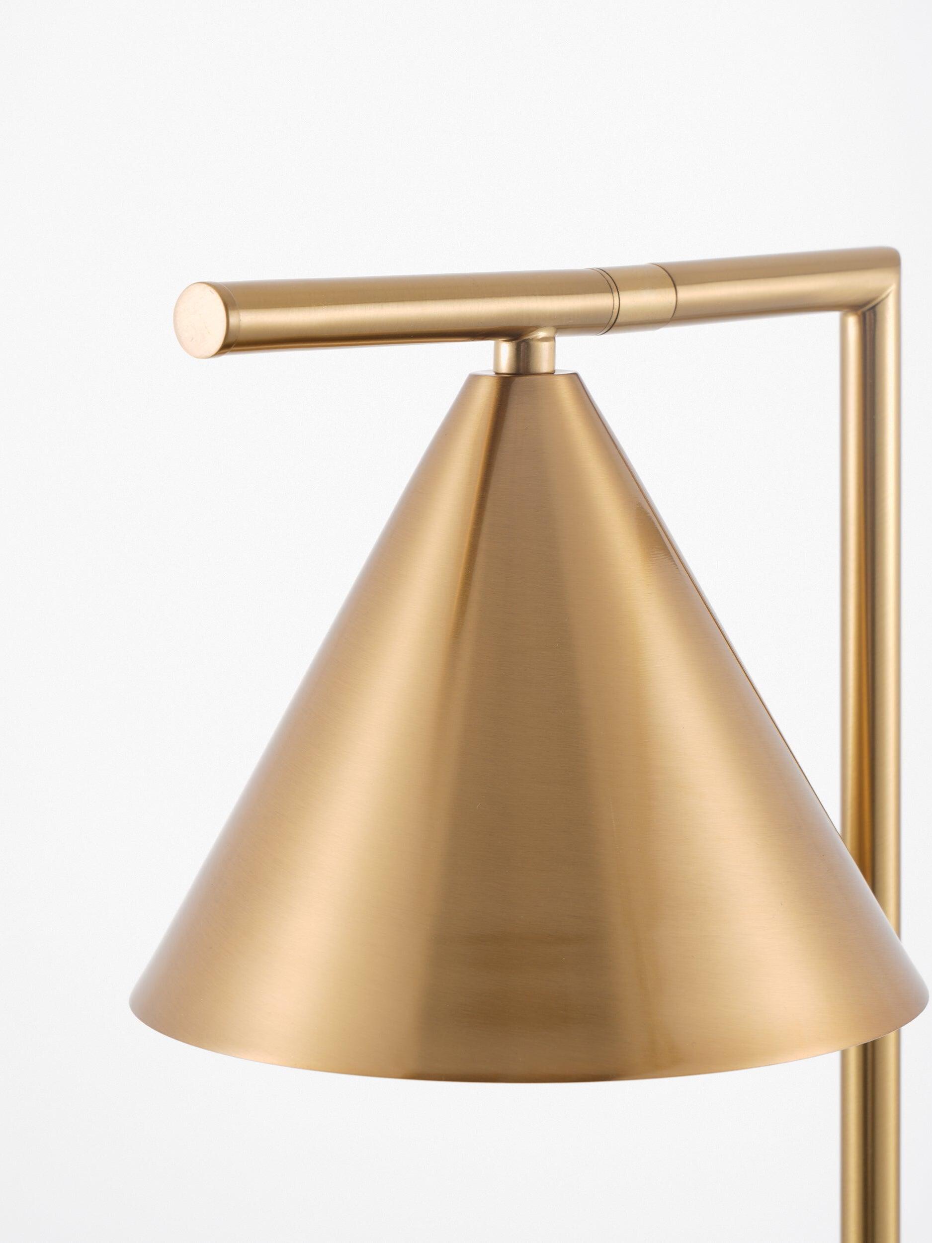Cone tip joint beneath gold-tone horizontal lamp arm