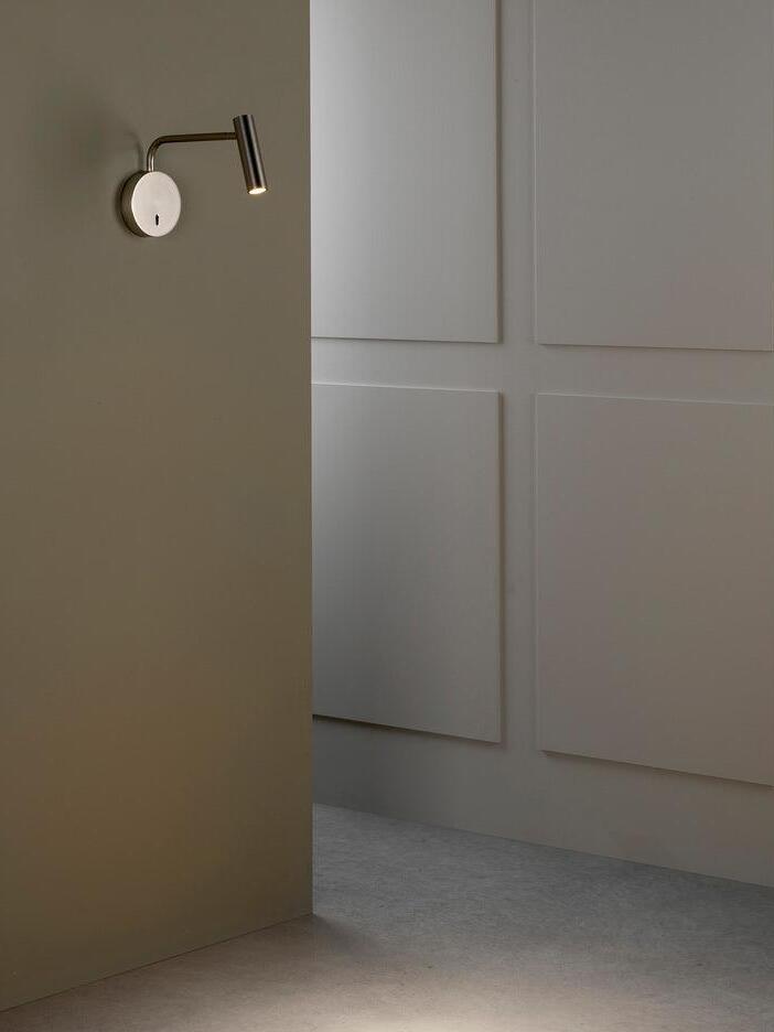 Small reading sconce beside a doorway