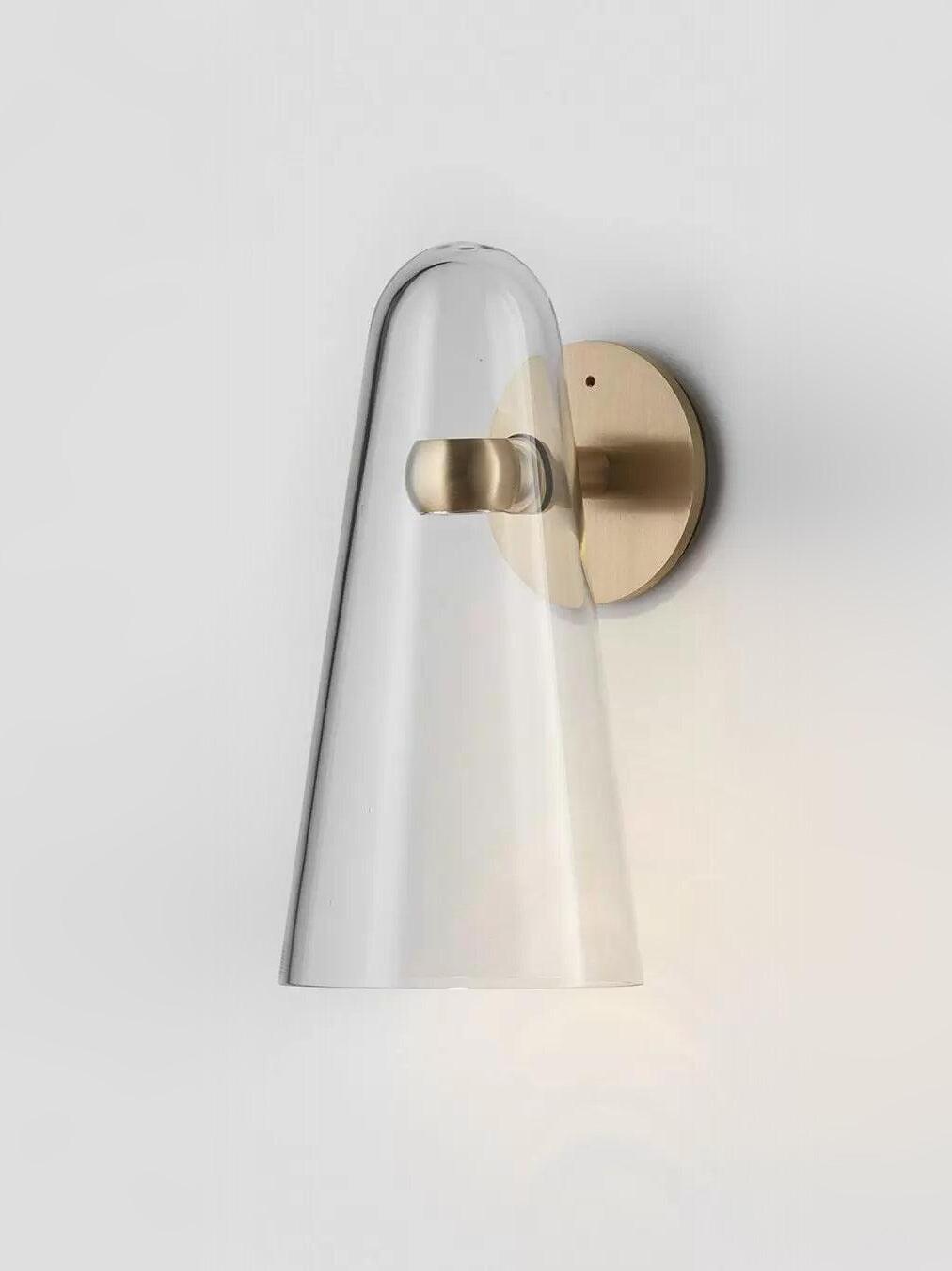 Clear tapered glass shade with a gold-coloured fitting and round backplate