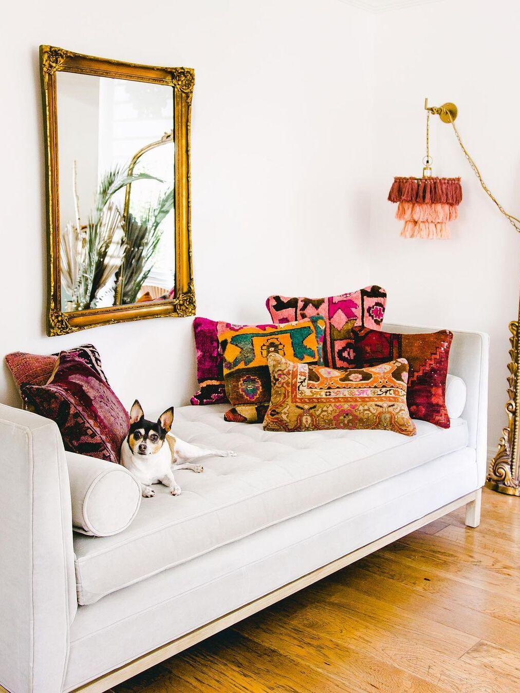 Multicolour tassel fixture above a white sofa