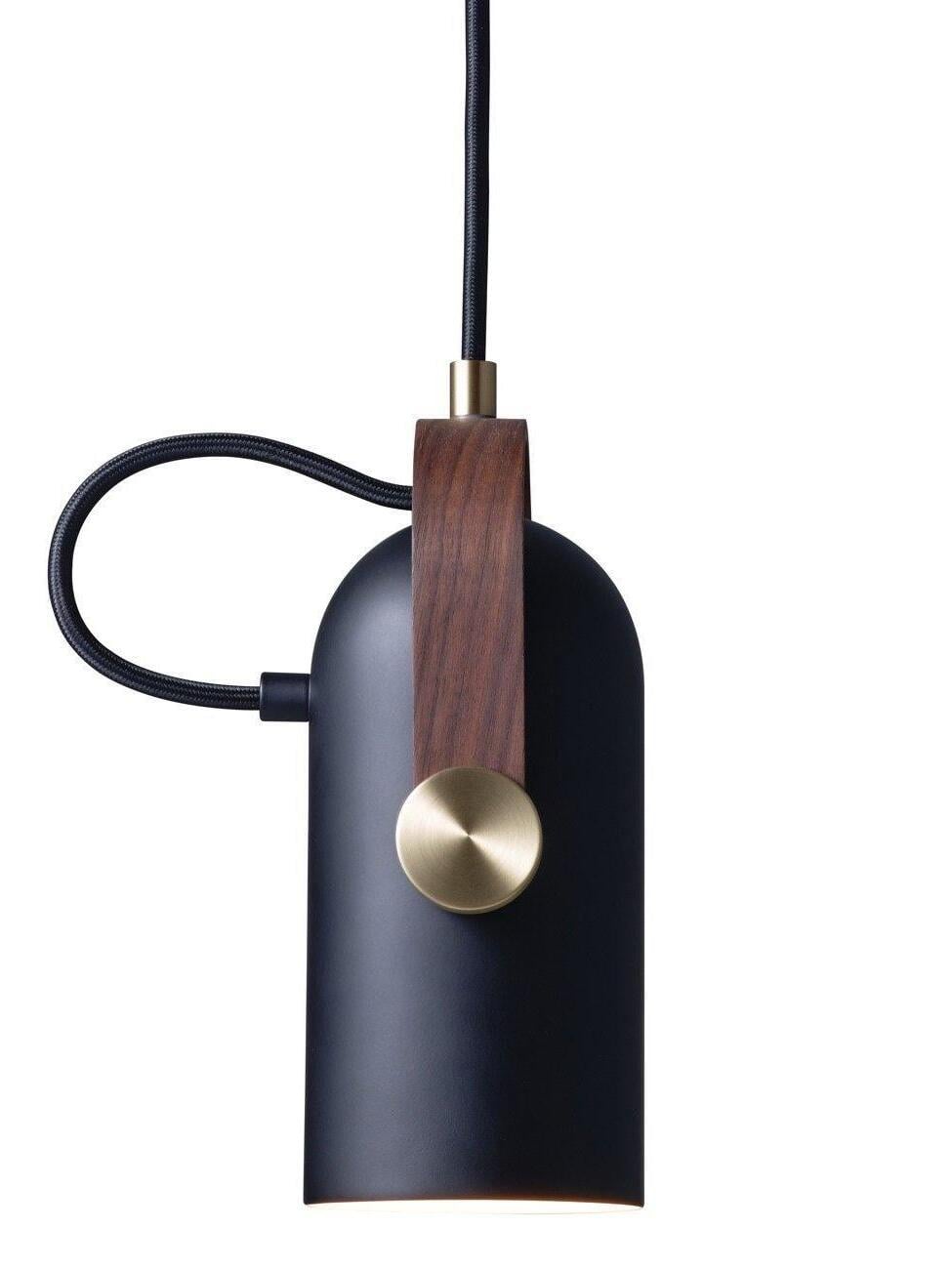 Vertical black pendant close-up with dark wood bracket, round gold-tone pivot, top sleeve and looped black cable