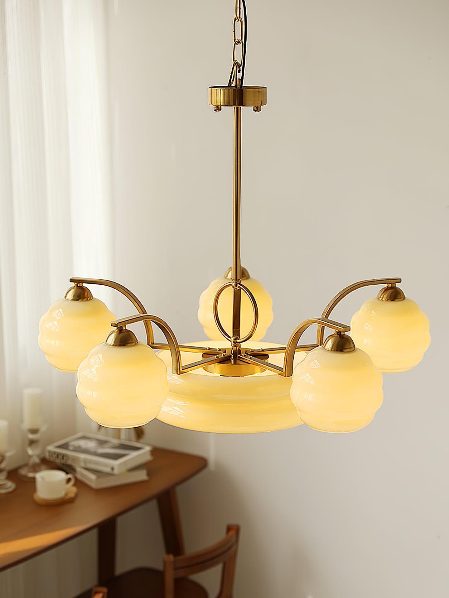 Curved-arm chandelier shown with an extended suspension