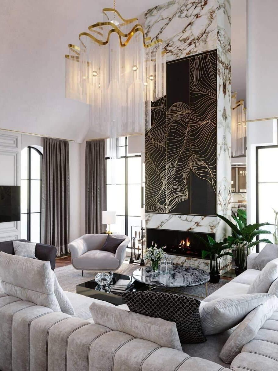 Gold-edged chain chandelier above pale sofas