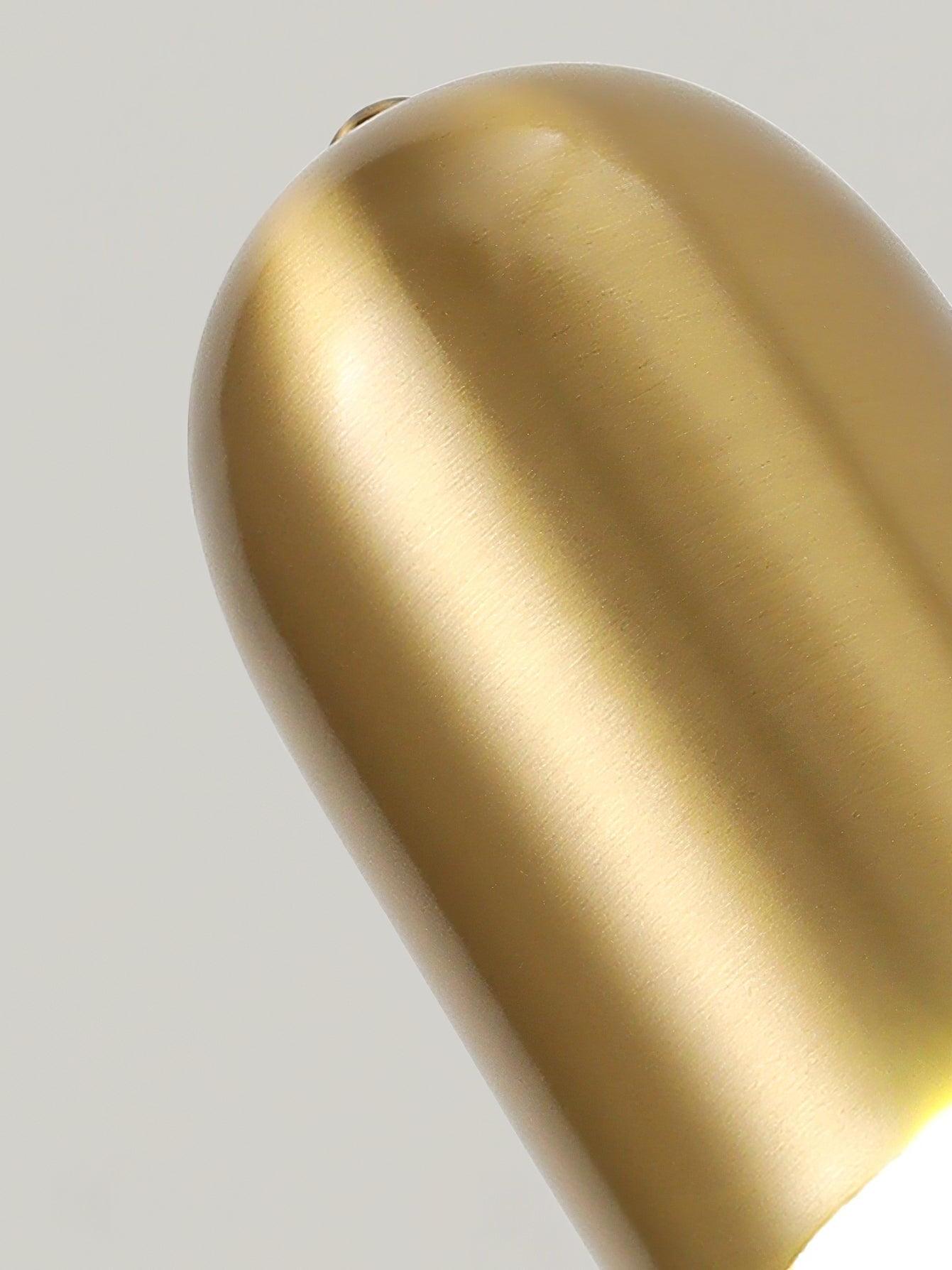 Close view of brushed gold cylindrical shade