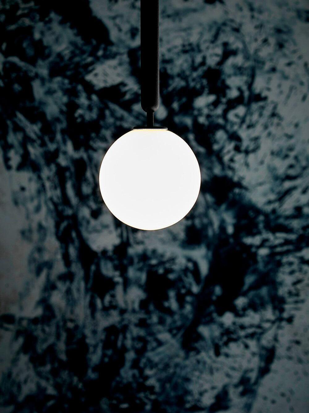 White glowing globe with black stem close view
