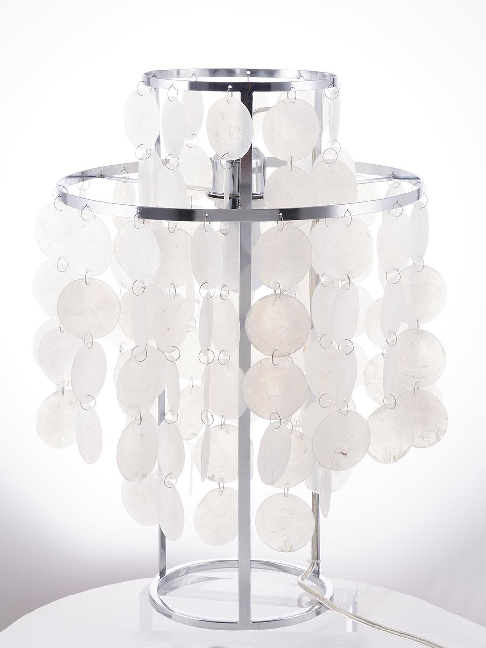 Three-quarter chrome-tone shell lamp with white cable