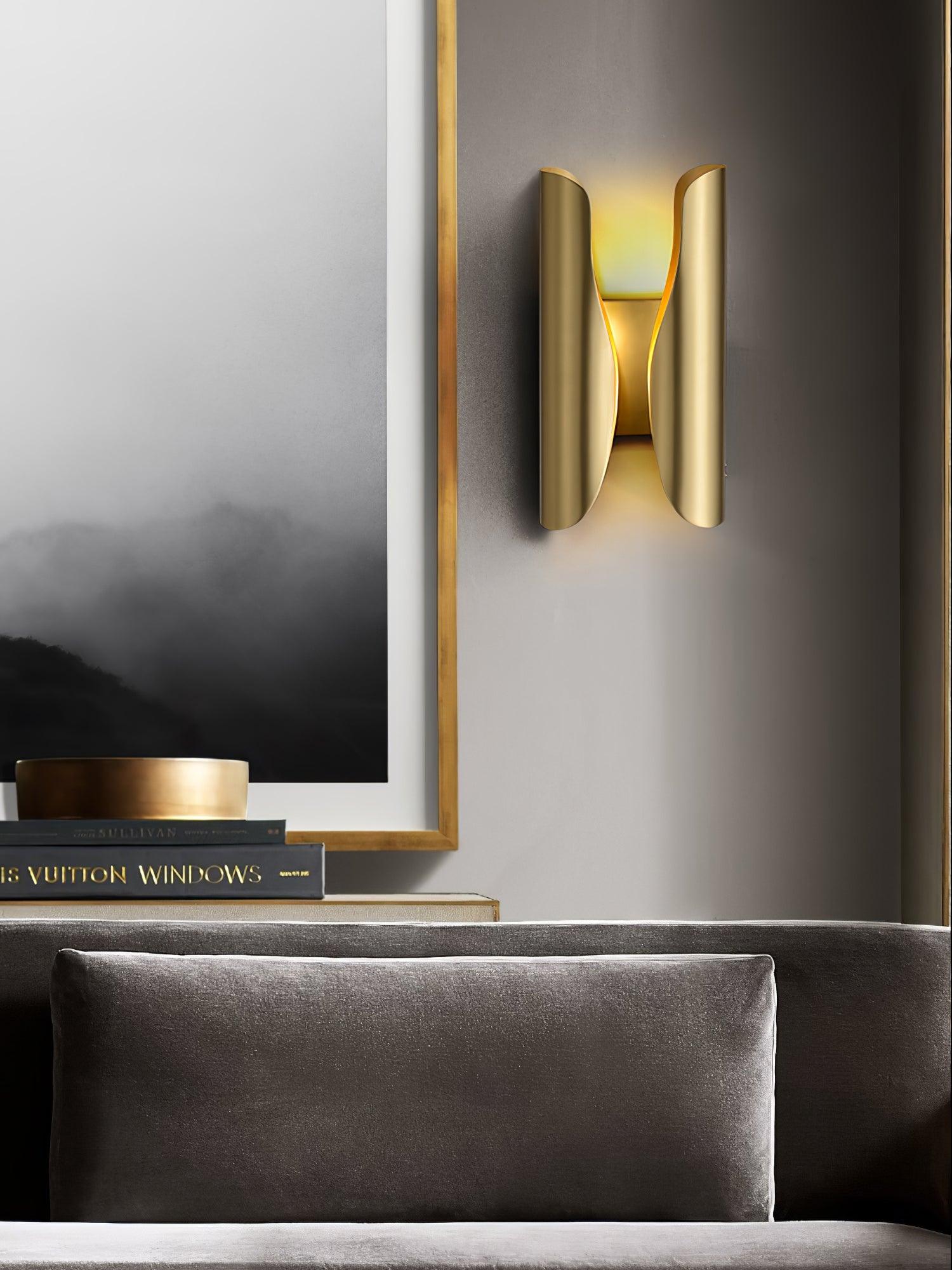 Brushed brass Guardian beside a framed display and sofa