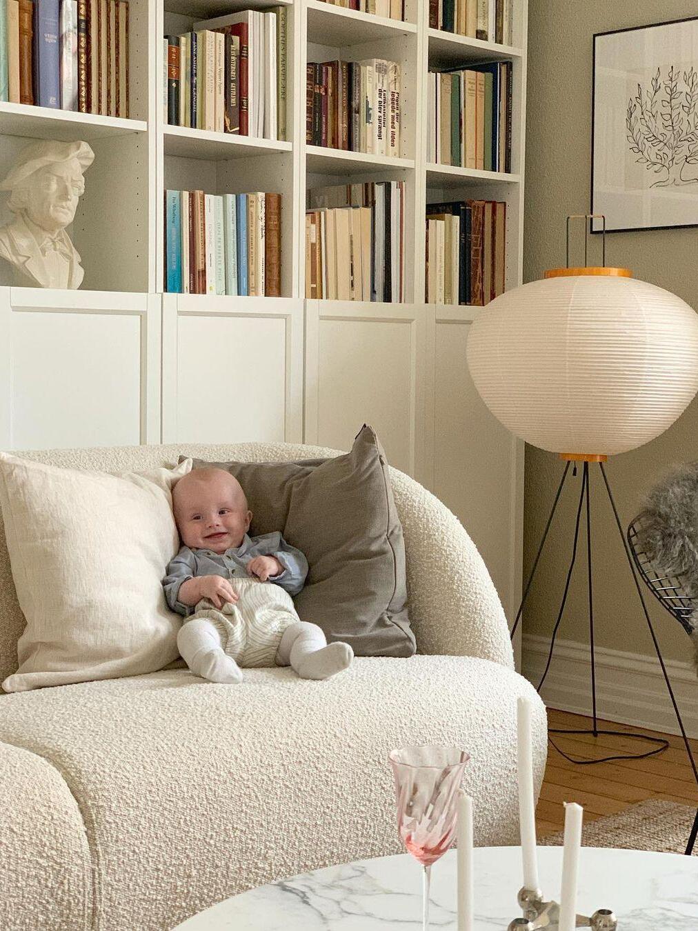 Paper floor lamp beside a sofa