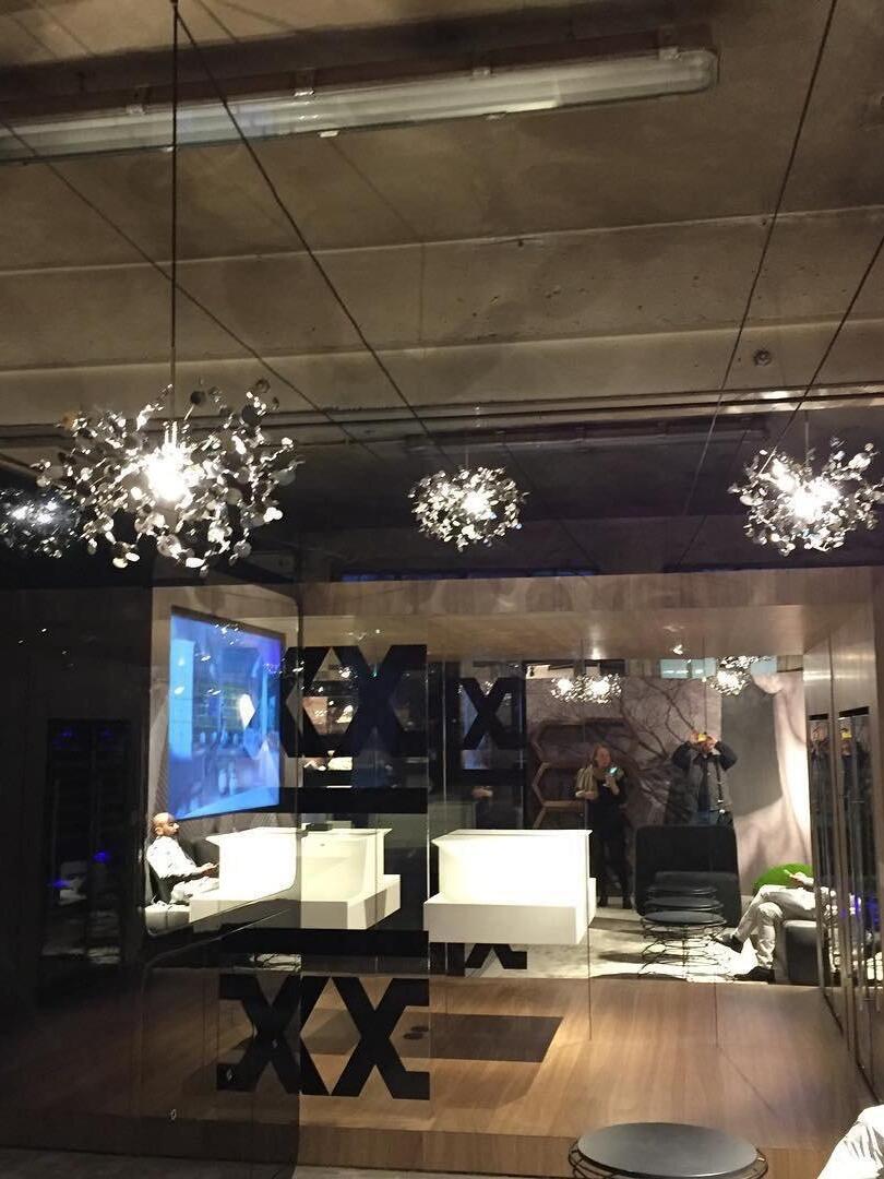 Separate silver disc clusters suspended in a dark interior