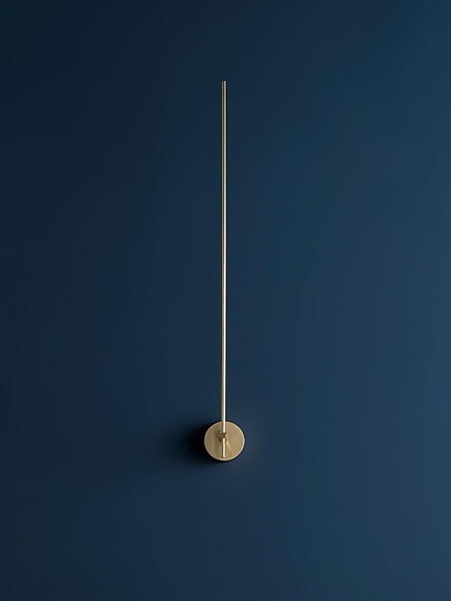 Front view of slim Gold rod and round wall plate