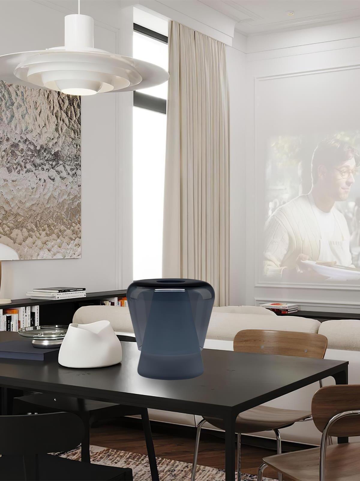 Blue Jumelle lamp on dark dining table