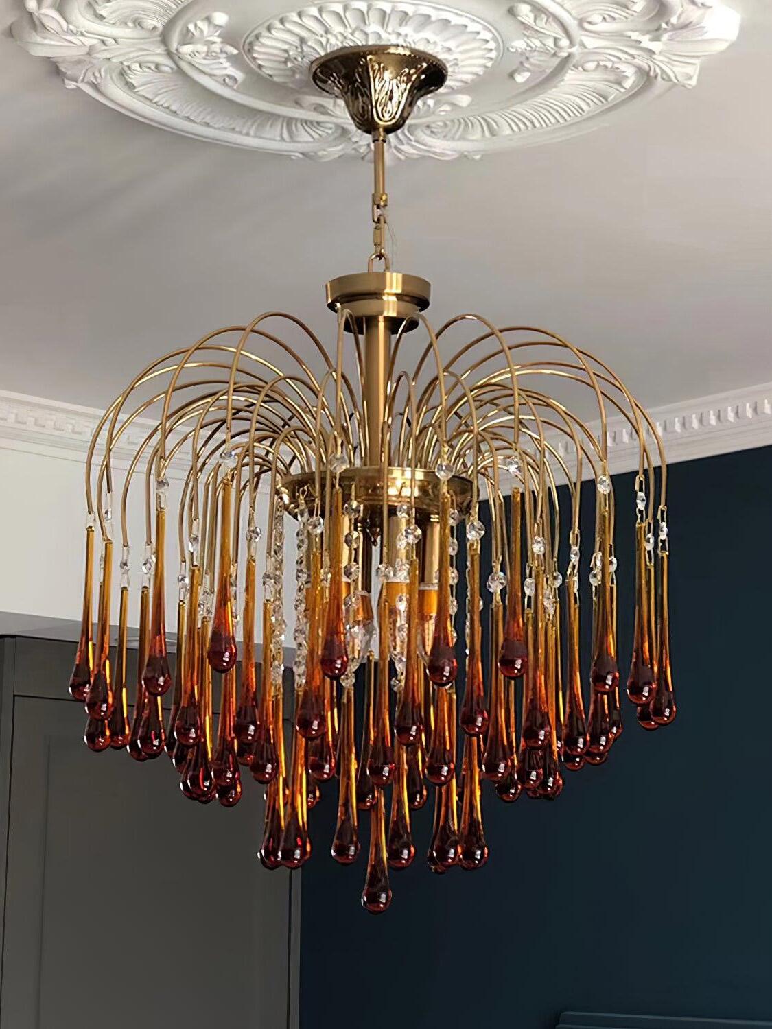 Crystal chandelier beneath a decorative ceiling rose