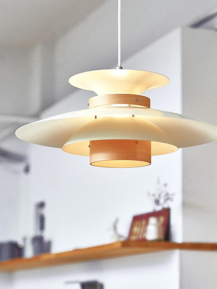 Close view of lighter wood accents and white shades