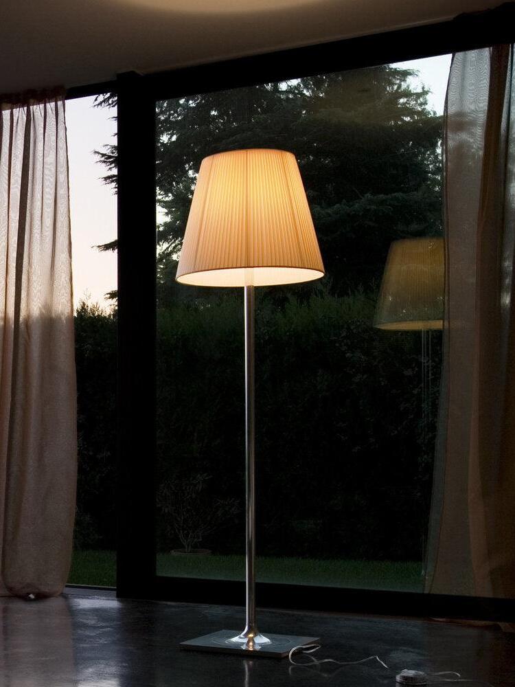 Ktribe floor lamp with a warm-looking shade beside a window
