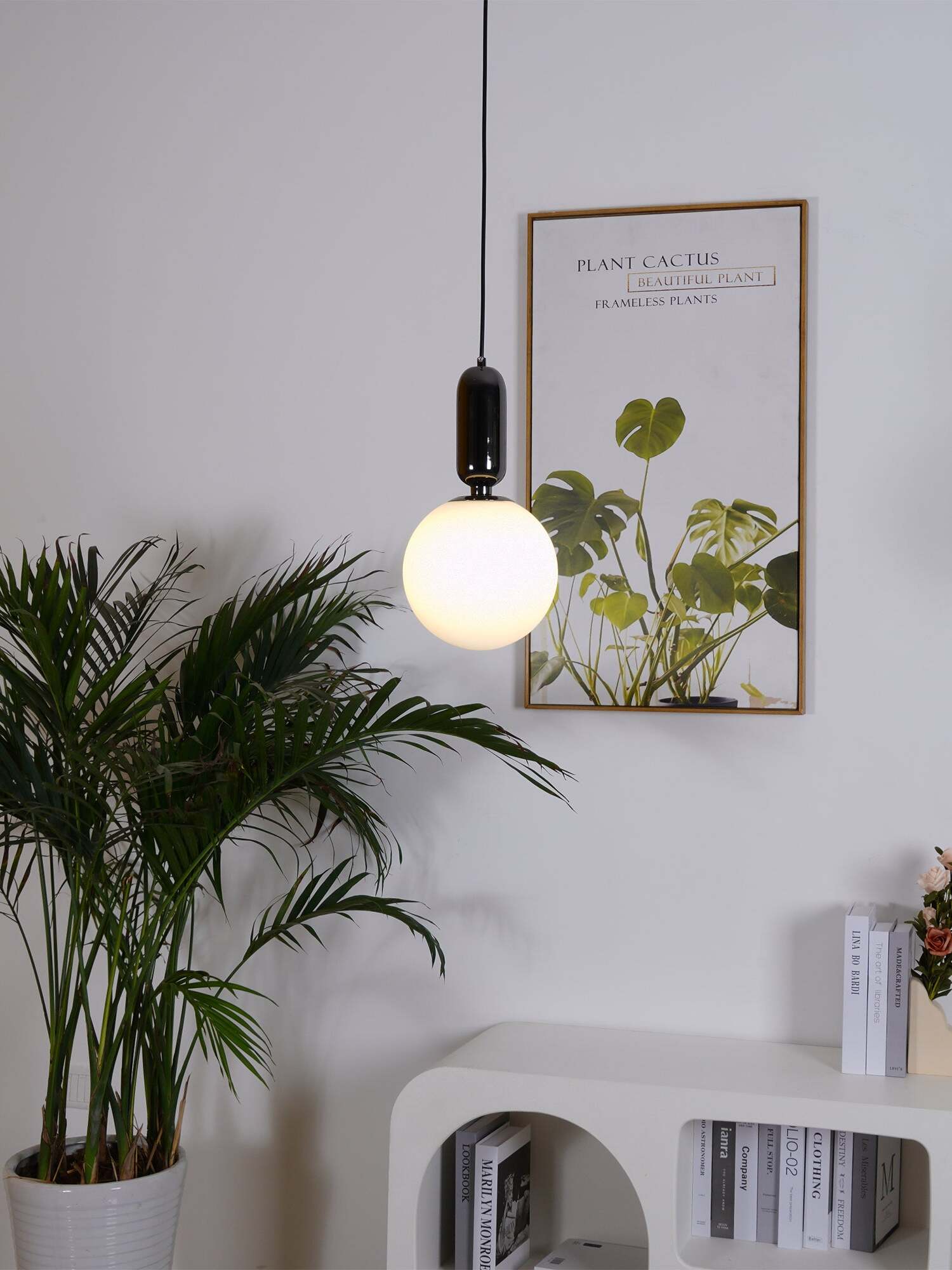 Black-cap white globe above a cabinet