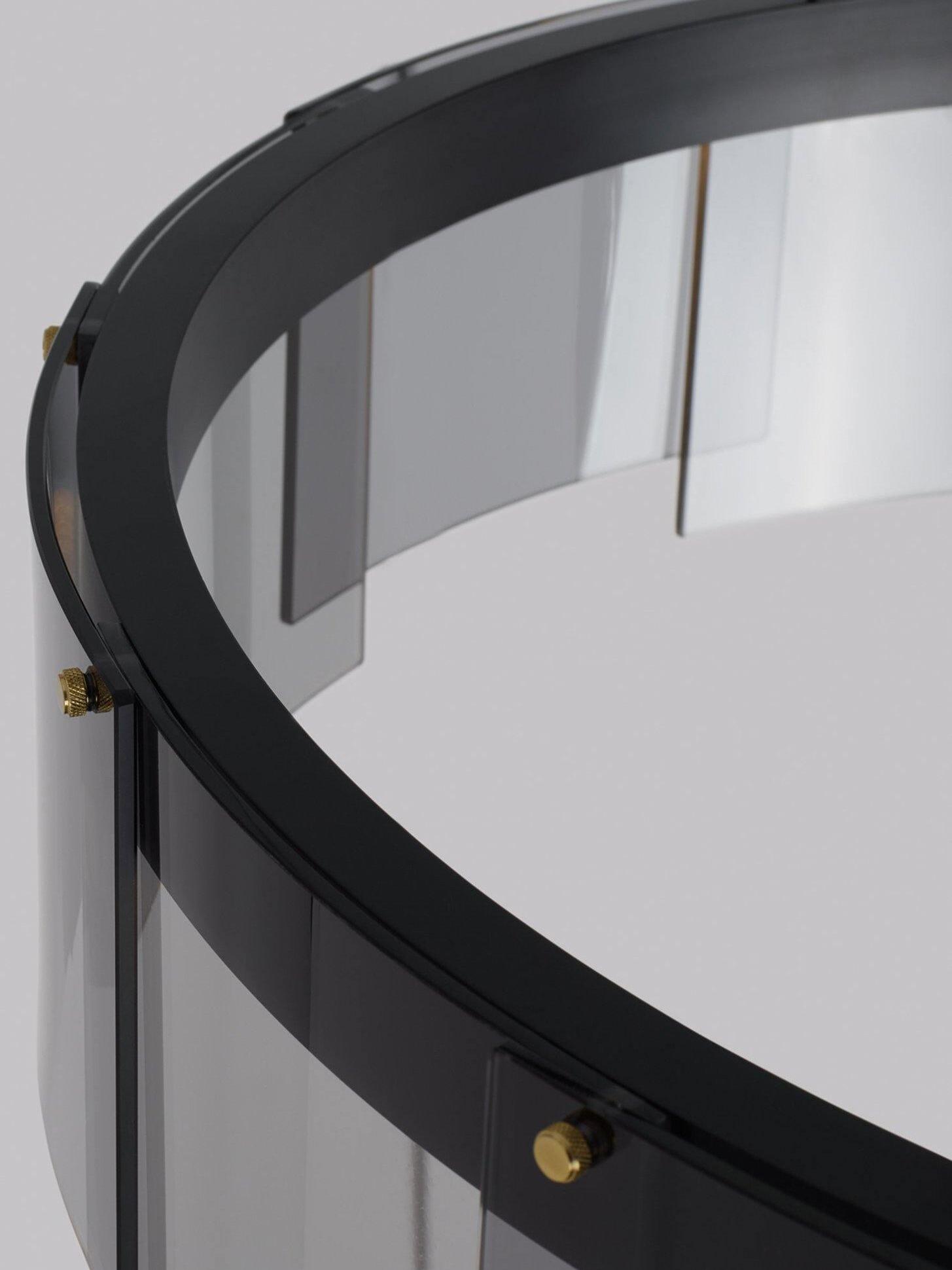 Black frame and curved glass fastening close-up