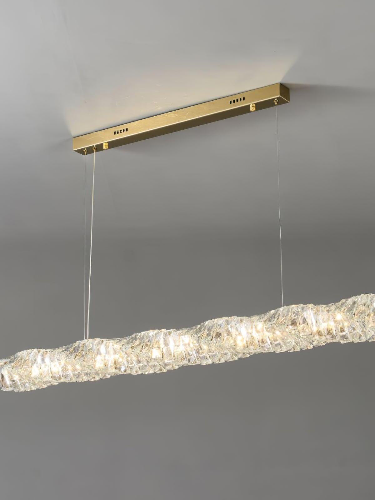 Angled view of the gold canopy and warm-looking faceted crystal bar