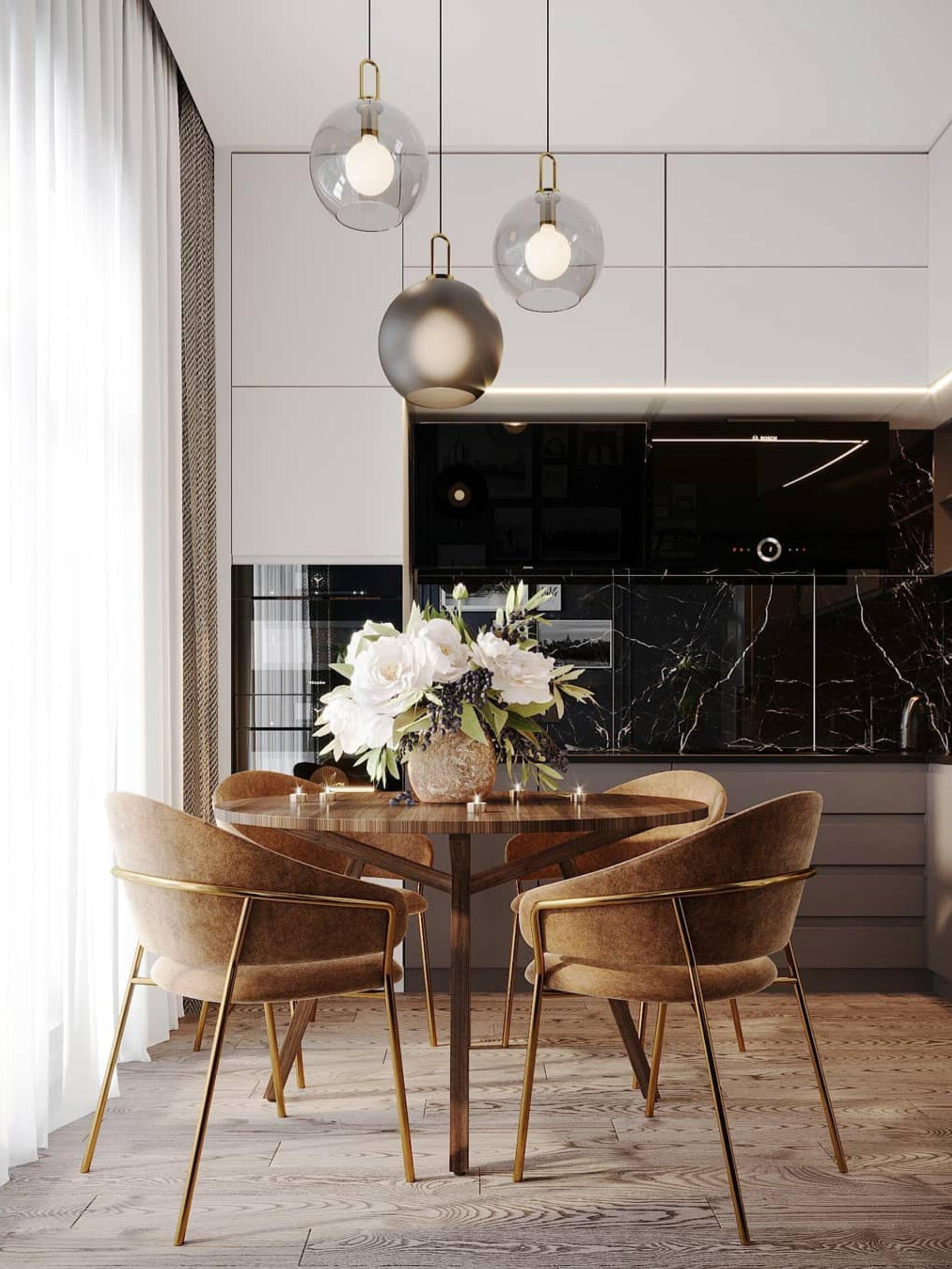 Clear and frosted globes above a table beside the kitchen