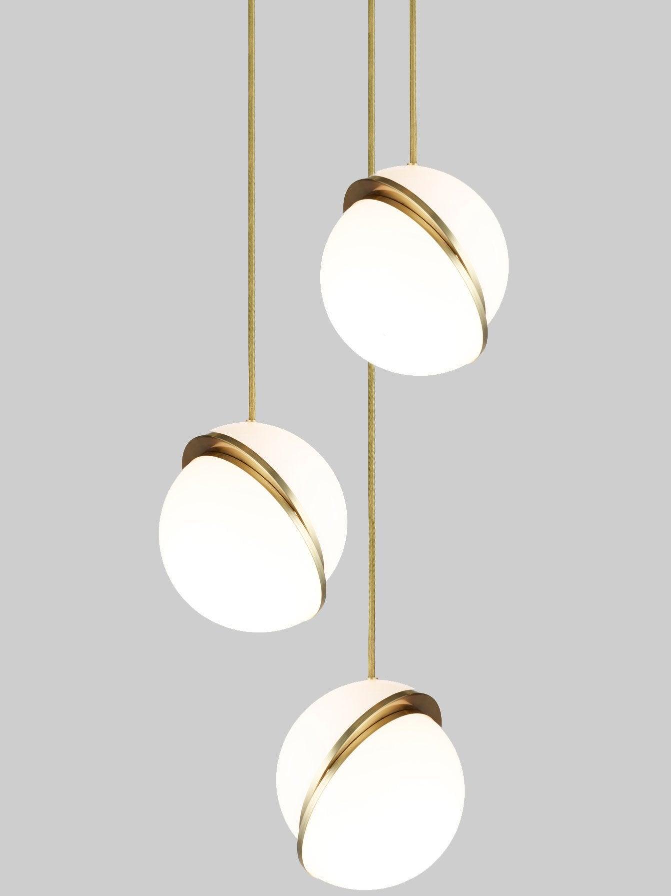 Crescent three-head arrangement with offset white globes and gold-colour bands at different drops against grey