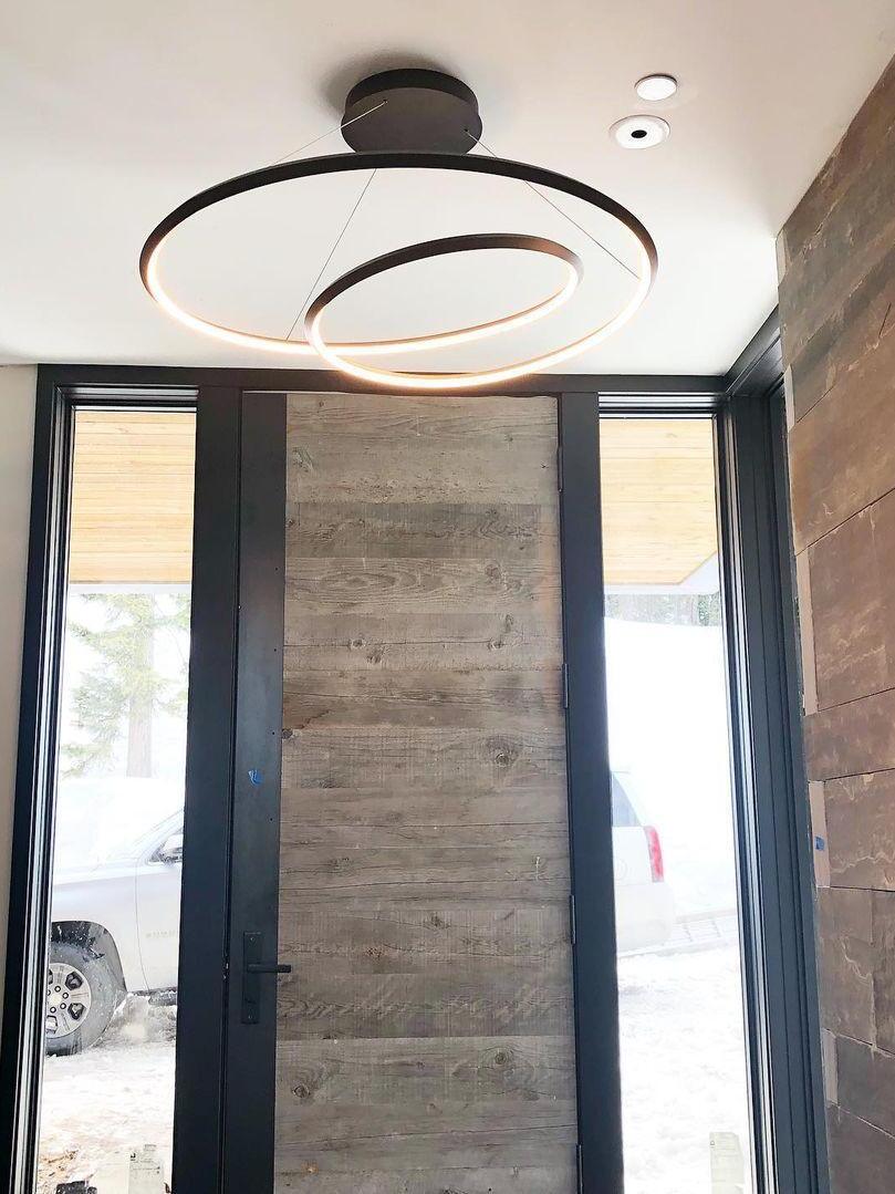 Black looping band lit in a tall interior
