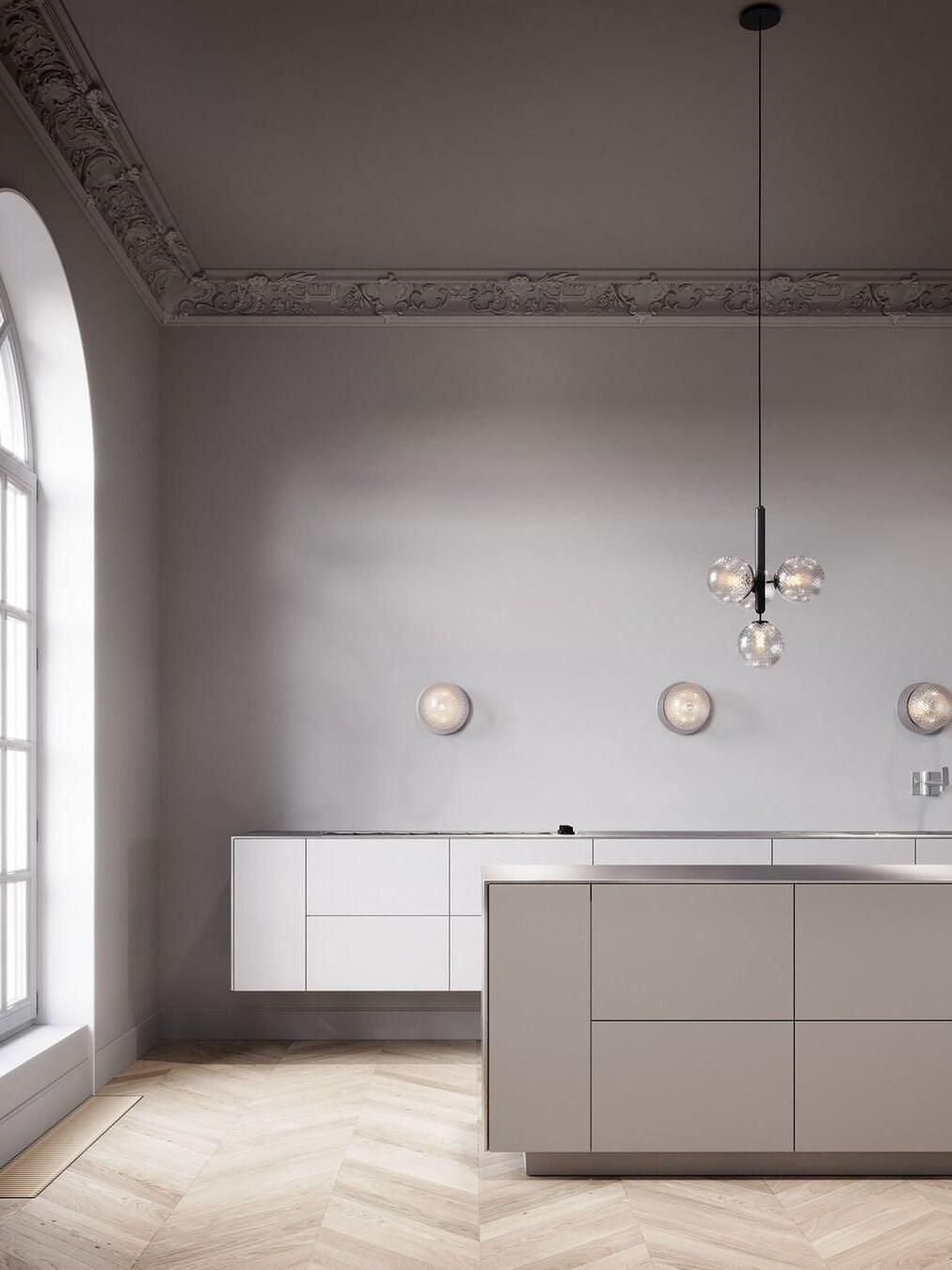Clear-globe clusters above a kitchen counter
