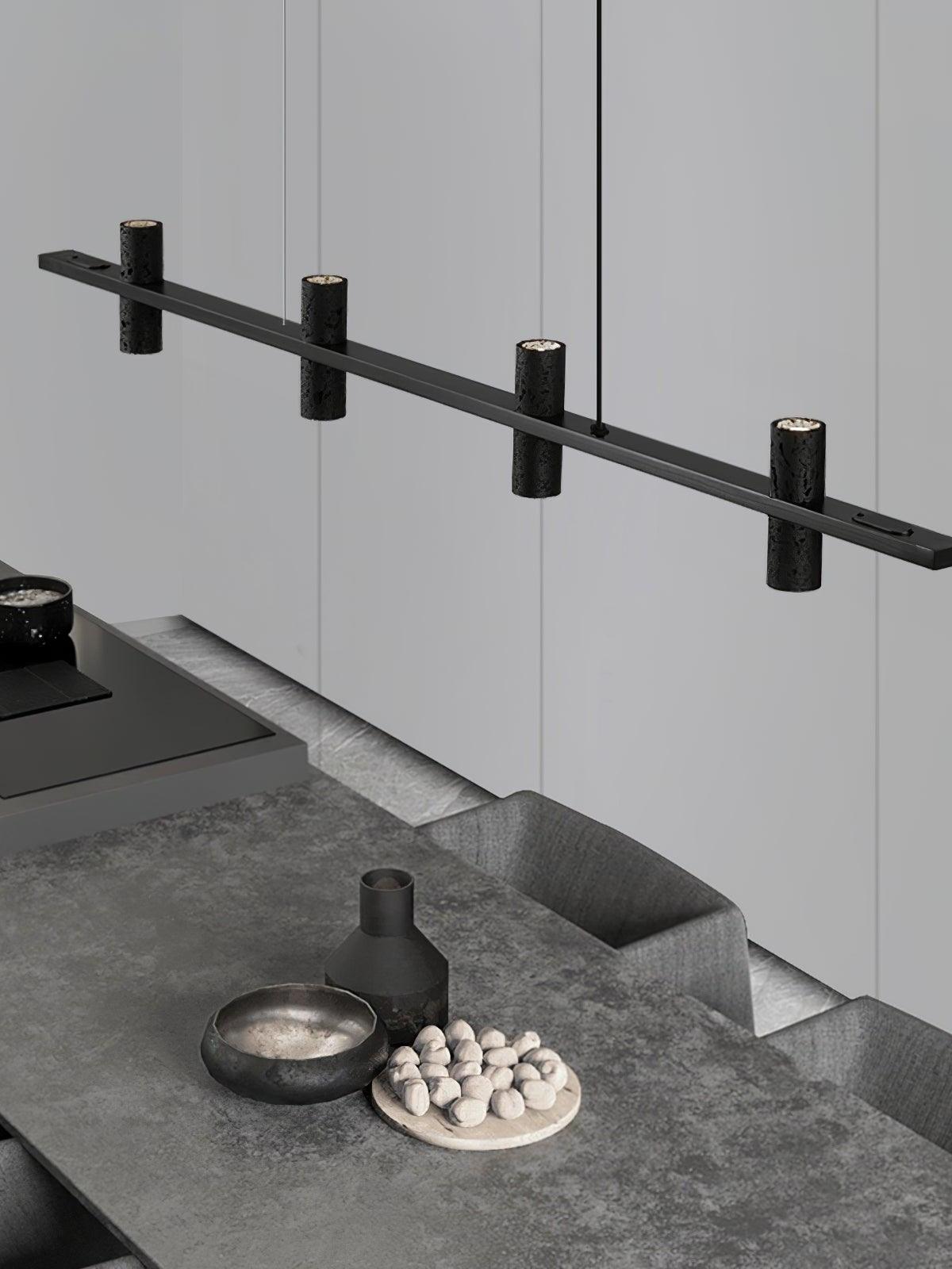 Angled bar and textured cylinders over an indoor table
