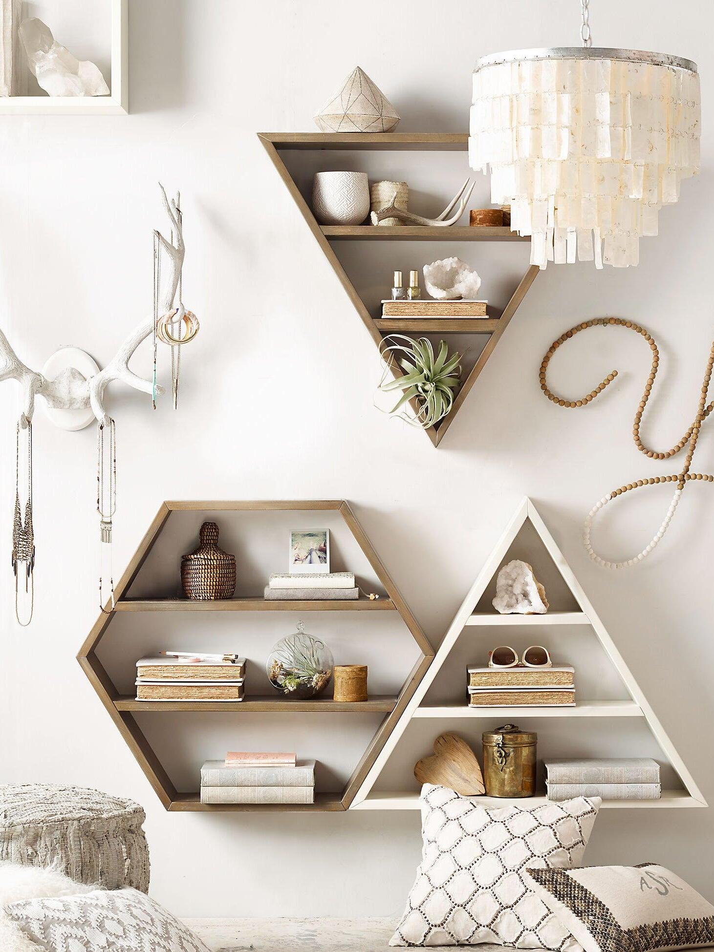 Bedroom corner with geometric wall decoration and a partial shell pendant