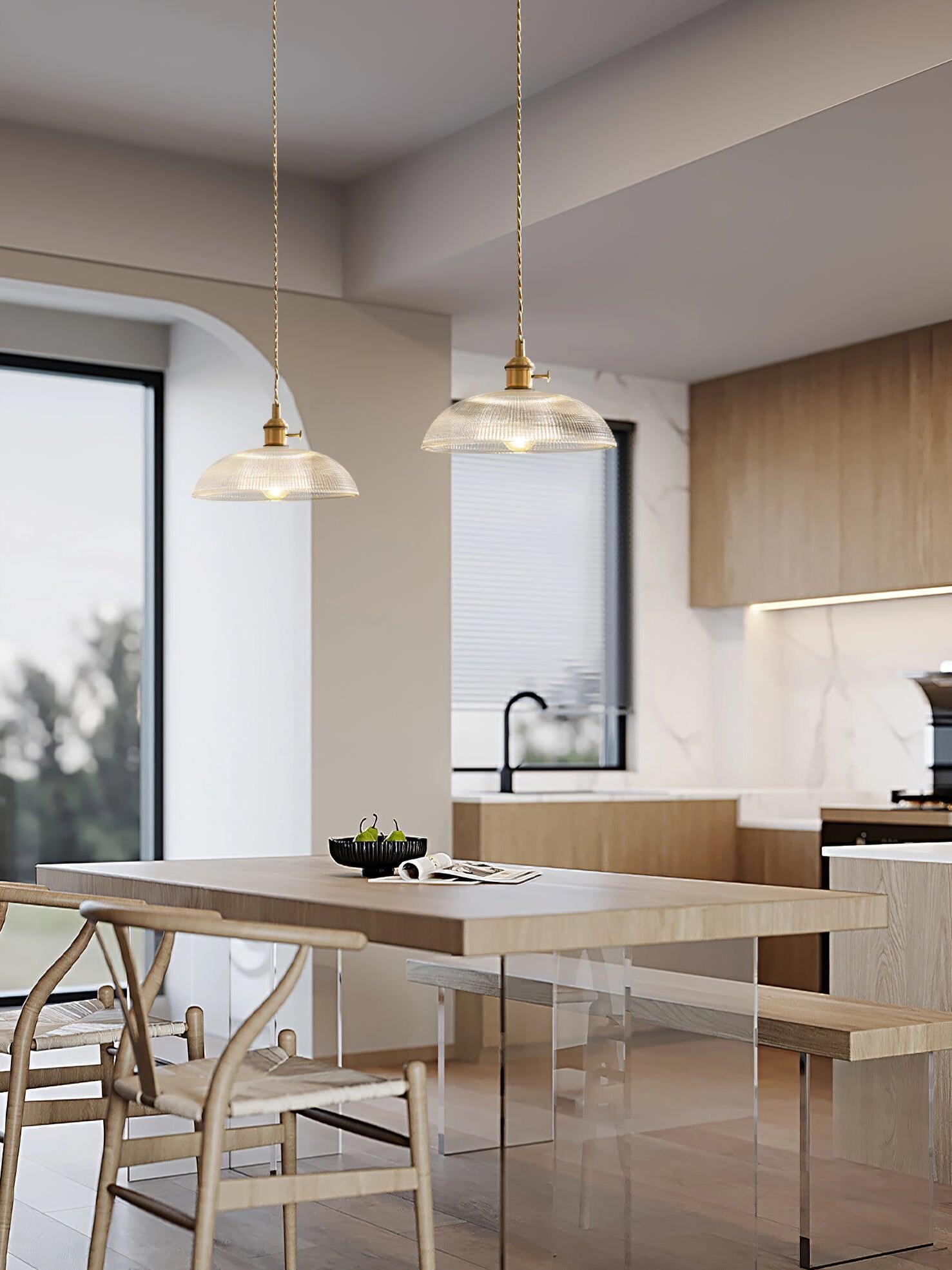Two separate glass pendants above kitchen island