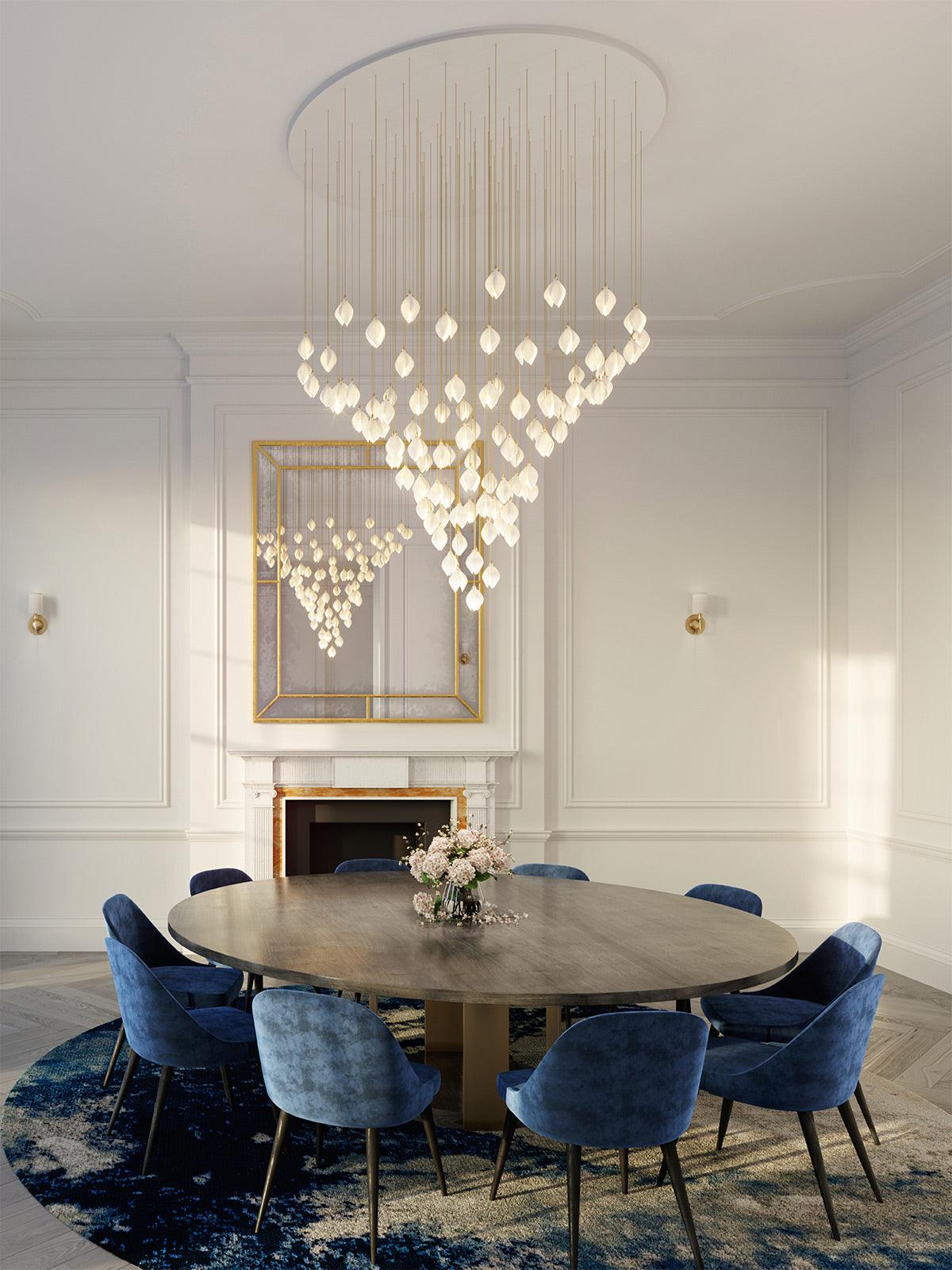 Tiered bud lights above a round dining table