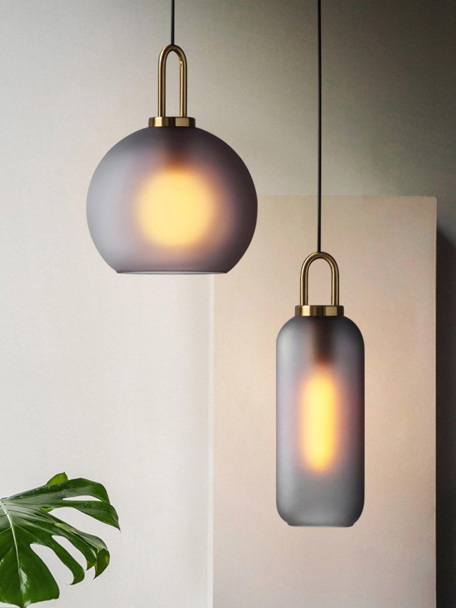 Frosted sphere and capsule glass shades shown together