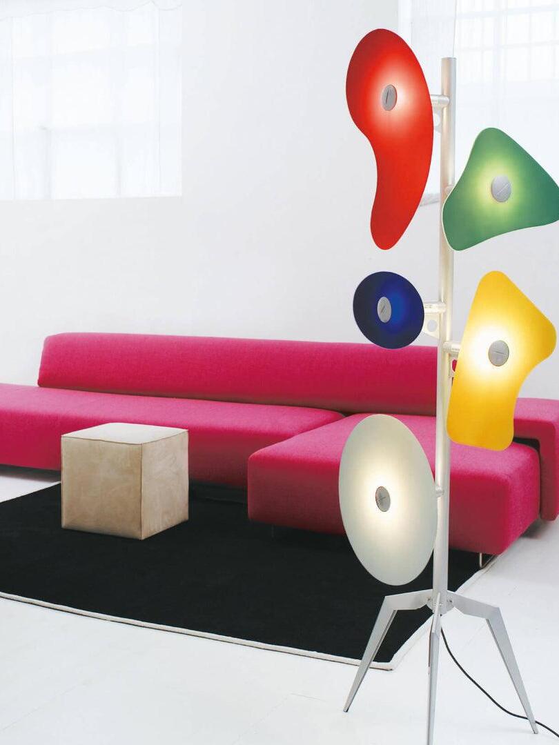 Multicolour panel lamp beside a pink sofa