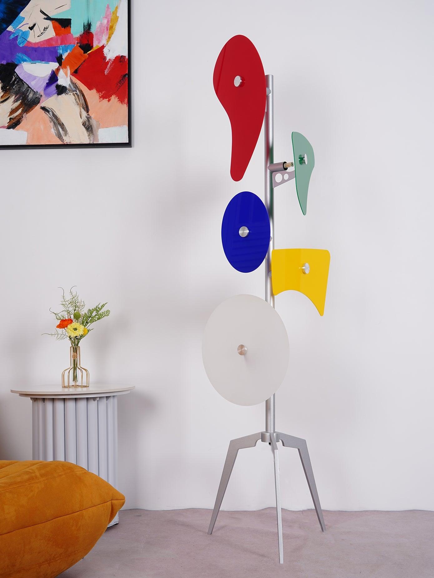 Unlit multicolour panel lamp beside wall art