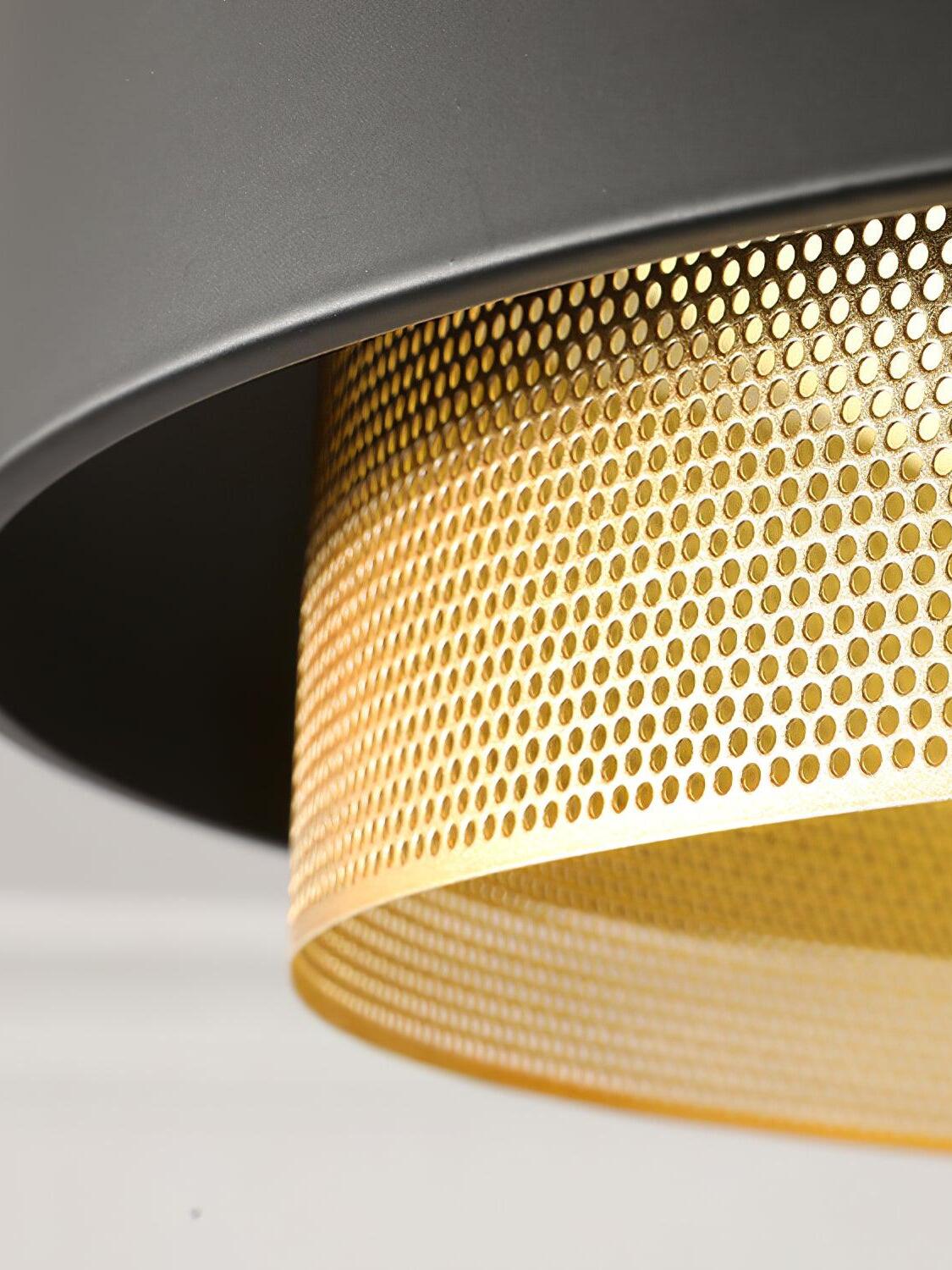 Close-up of the Nolan black outer band and small perforations in the gold-finish ring